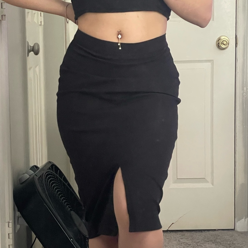 Black pencil skirt with a slit in the front